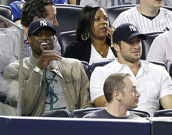 Tim Tebow, Dwyane Wade sit a row apart at Yankees game; Tebow wears NY ...