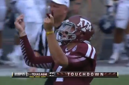 Johnny Manziel puffs on suspicious looking cigarette while