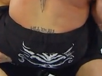 Brock Lesnar has tramp stamp tattoo that says Kill em All