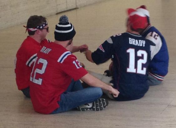 Protestors handcuff themselves together at NFL office to support Tom Brady