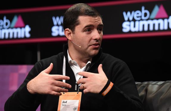 Owner Jed York of the San Francisco 49ers stands on the field