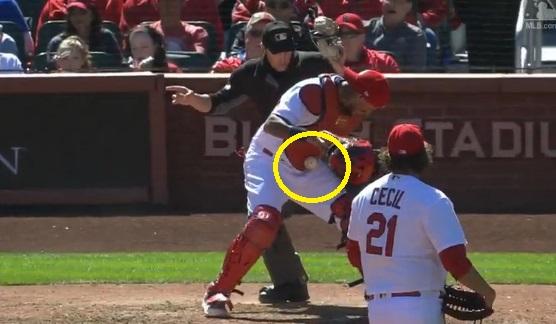 A baseball wedged itself in Yadier Molina's chest protector, seemingly  defying the laws of physics