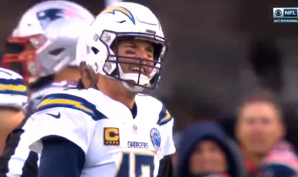 Los Angeles Chargers head coach Anthony Lynn, center, reacts on the  sideline after a replay is shown on a stadium video monitor during the  second half of an NFL football game against