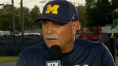 Don Brown in a Michigan hat