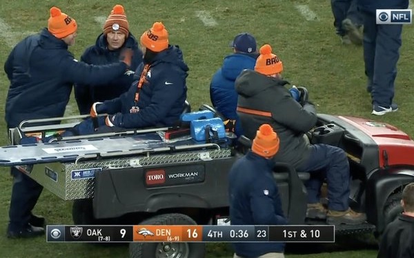 Unidentified Denver Broncos fans in the front of Macy s Herald