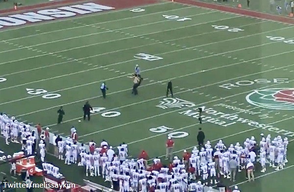 Super Bowl fan runs onto field during second half of game