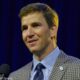 Eli Manning in a coat and tie
