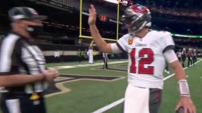 Tom Brady gives a ref a high five