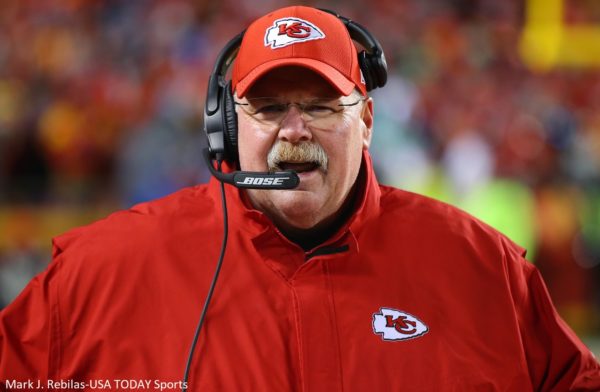 Andy Reid with a headset on