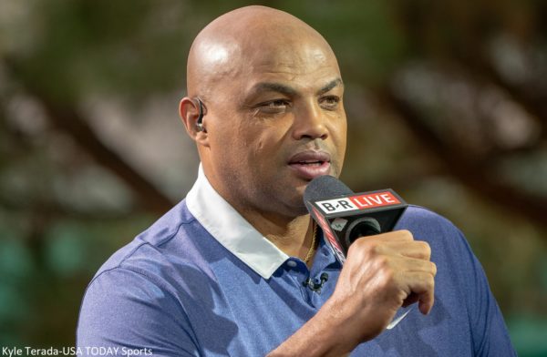 Charles Barkley holds a microphone