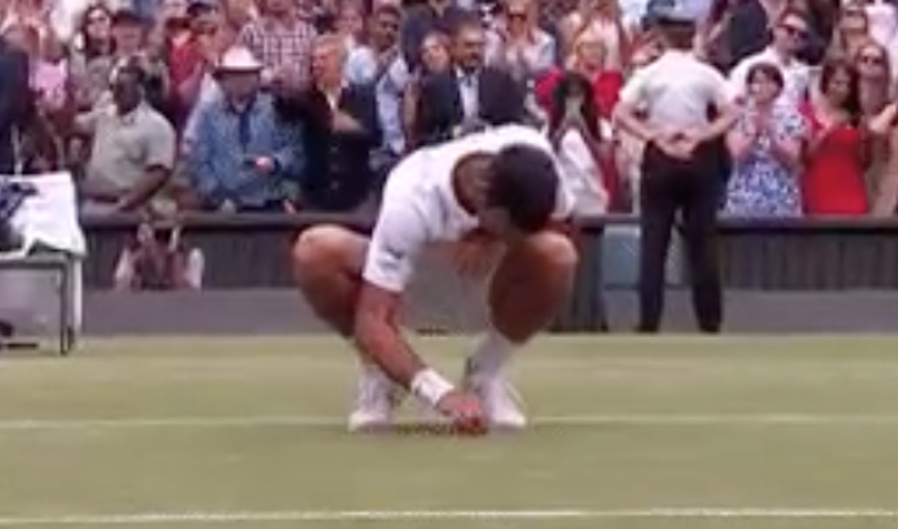 Novak Djokovic eats grass