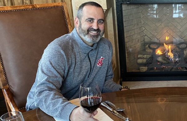 Nick Rolovich with a Washington State shirt