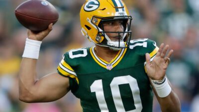 Jordan Love throws a pass