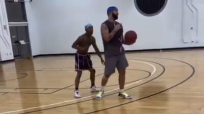 Drake playing basketball