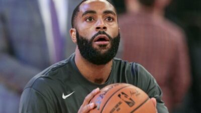 Wayne Ellington holds a basketball in his hands