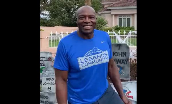 Bruce Smith stands in front of his graveyard