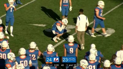 Colin Schuetz crouching