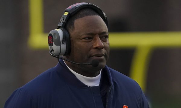 Dino Babers wearing a headset