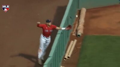 Hunter Renfroe reaches for a ball over the wall
