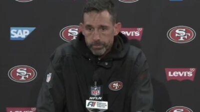 Kyle Shanahan talks with the media