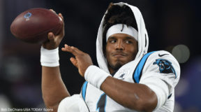 Cam Newton throws before a game