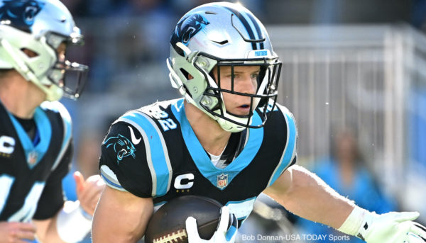 Christian McCaffrey rushes with the ball