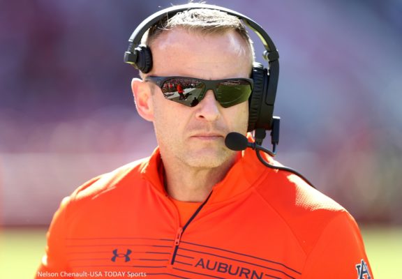 Bryan Harsin with a headset on