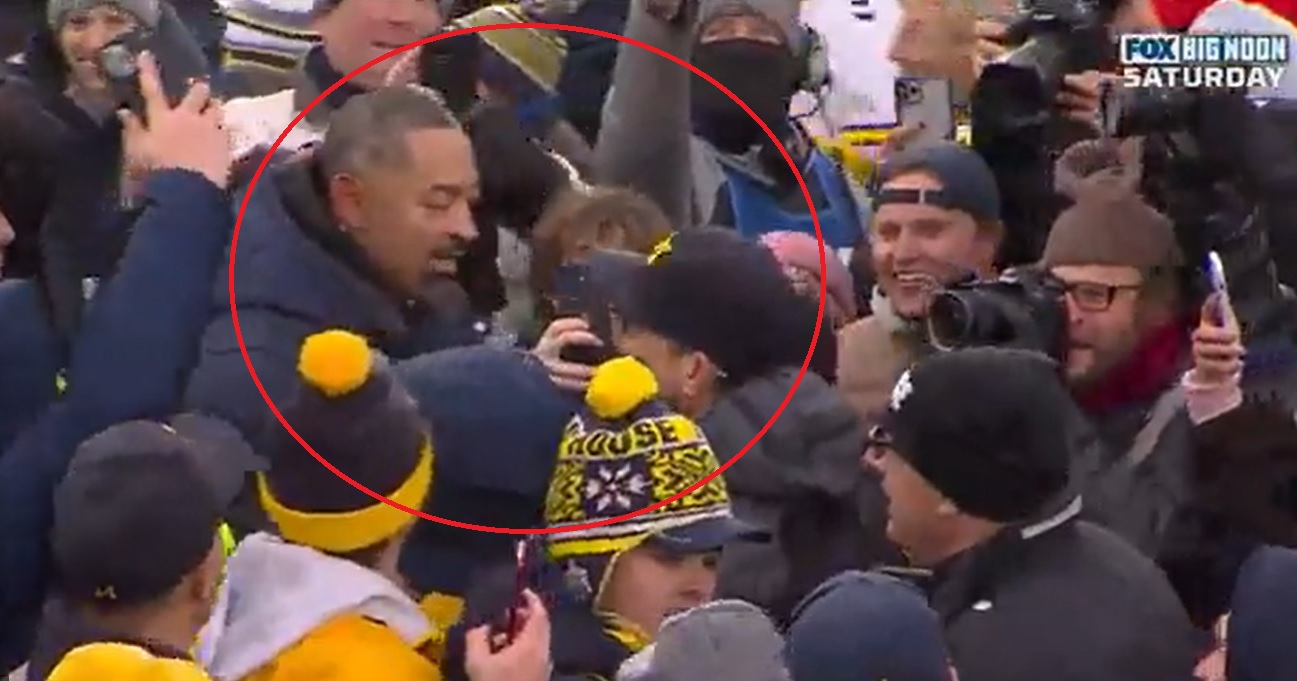 Juwan Howard congratulates Jim harbaugh