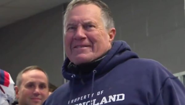 Bill Belichick smiles in the locker room