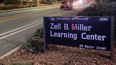 Georgia fans cross out M's on signs