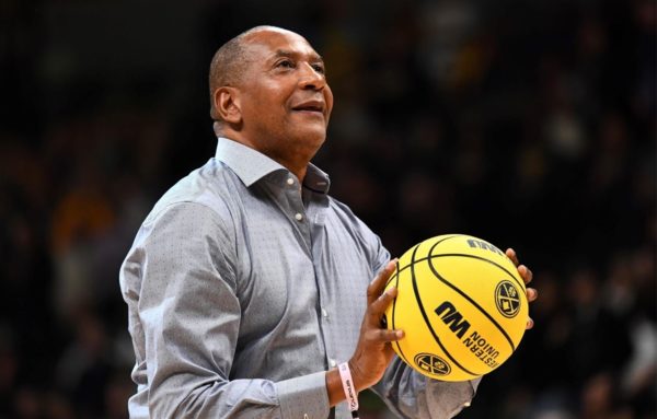 Alex English with a basketball