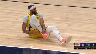 Anthony Davis grabs his ankle