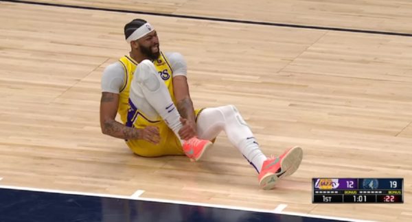 Anthony Davis grabs his ankle