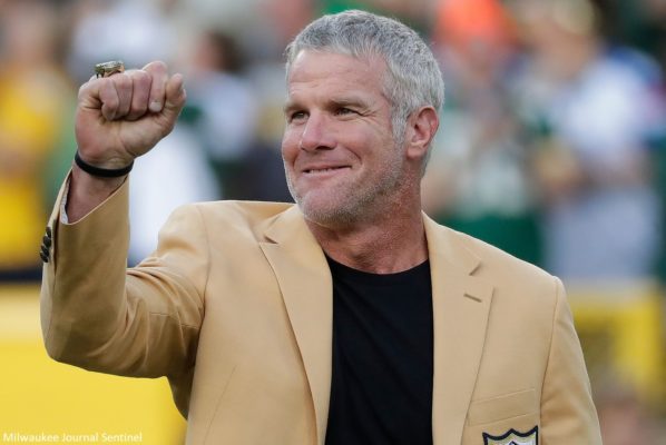 Brett Favre with an arm raised