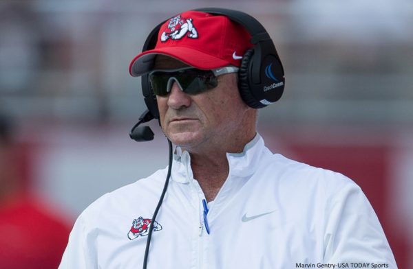 Jeff Tedford wearing a headset