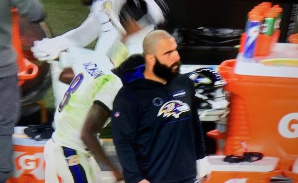 Lamar Jackson raises his helmet