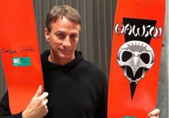 Tony Hawk holds a skateboard