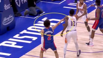 Cade Cunningham points at the bench