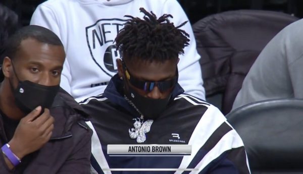 Antonio Brown sitting courtside