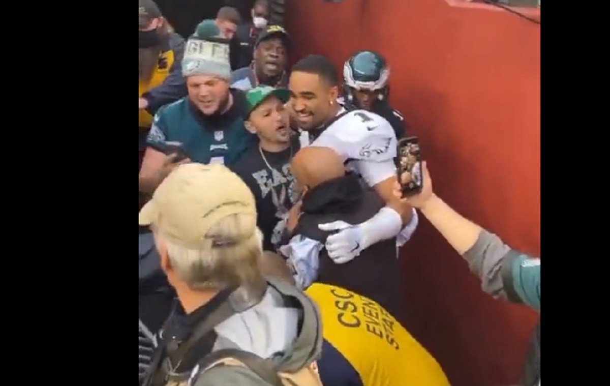 Philadelphia Eagles' Jalen Hurts, right, poses with the fan who