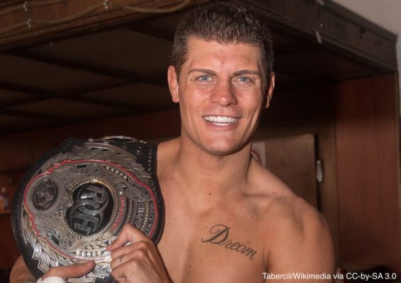 Cody Rhodes holds a championship belt