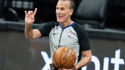 Ken Mauer holds a ball