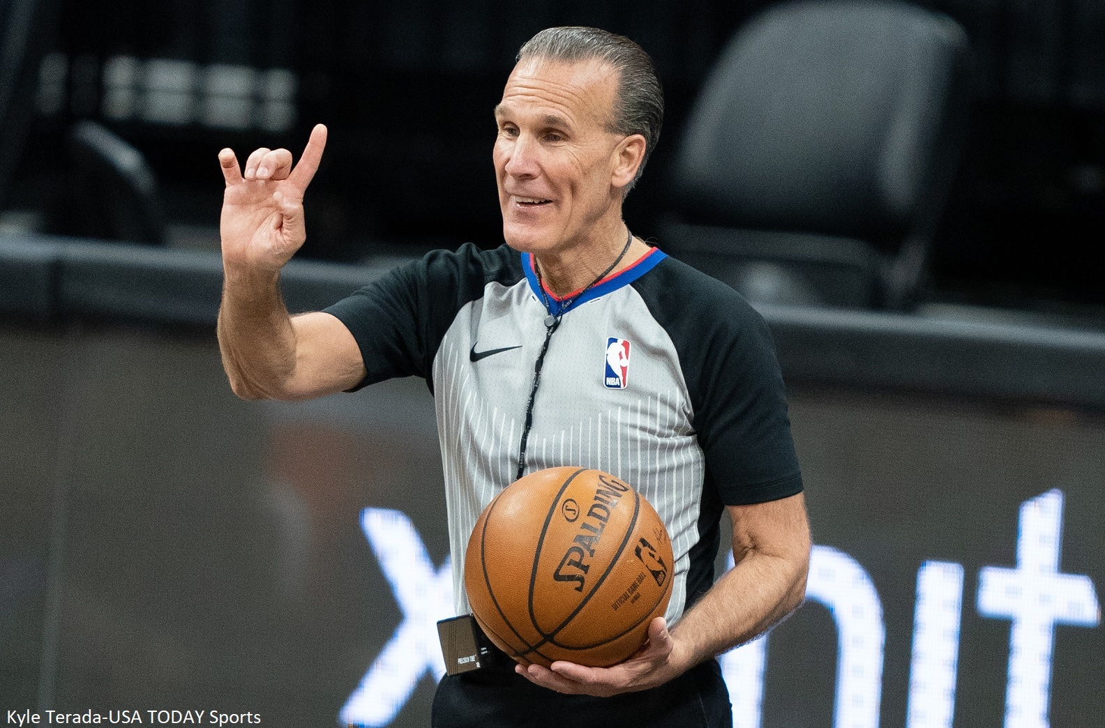 Ken Mauer holds a ball
