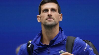 Novak Djokovic holds his bag