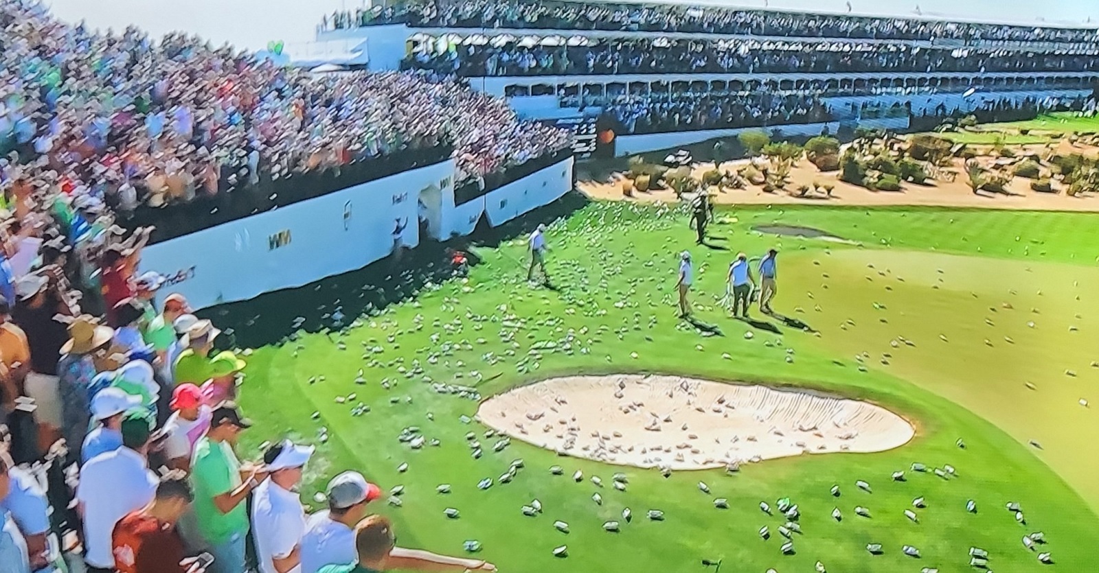 Fans shower 16th hole at Phoenix Open in beer cans after hole-in-one