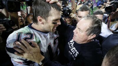 Bill Belichick pats Tom Brady