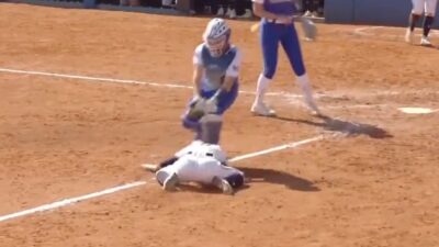 Alex Whitemore avoids a tag