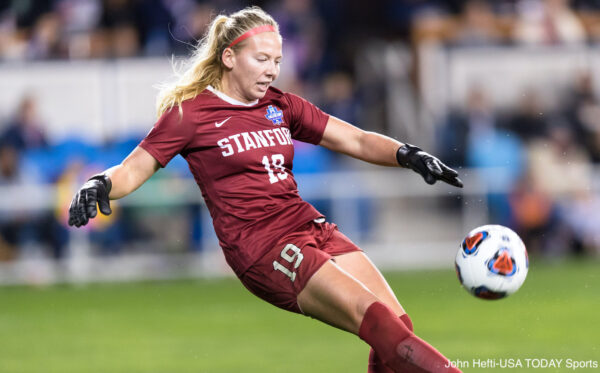 Katie Meyer kicks a ball