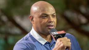 Charles Barkley holds a microphone