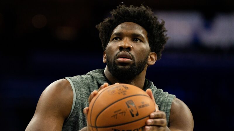 Joel Embiid holds a ball